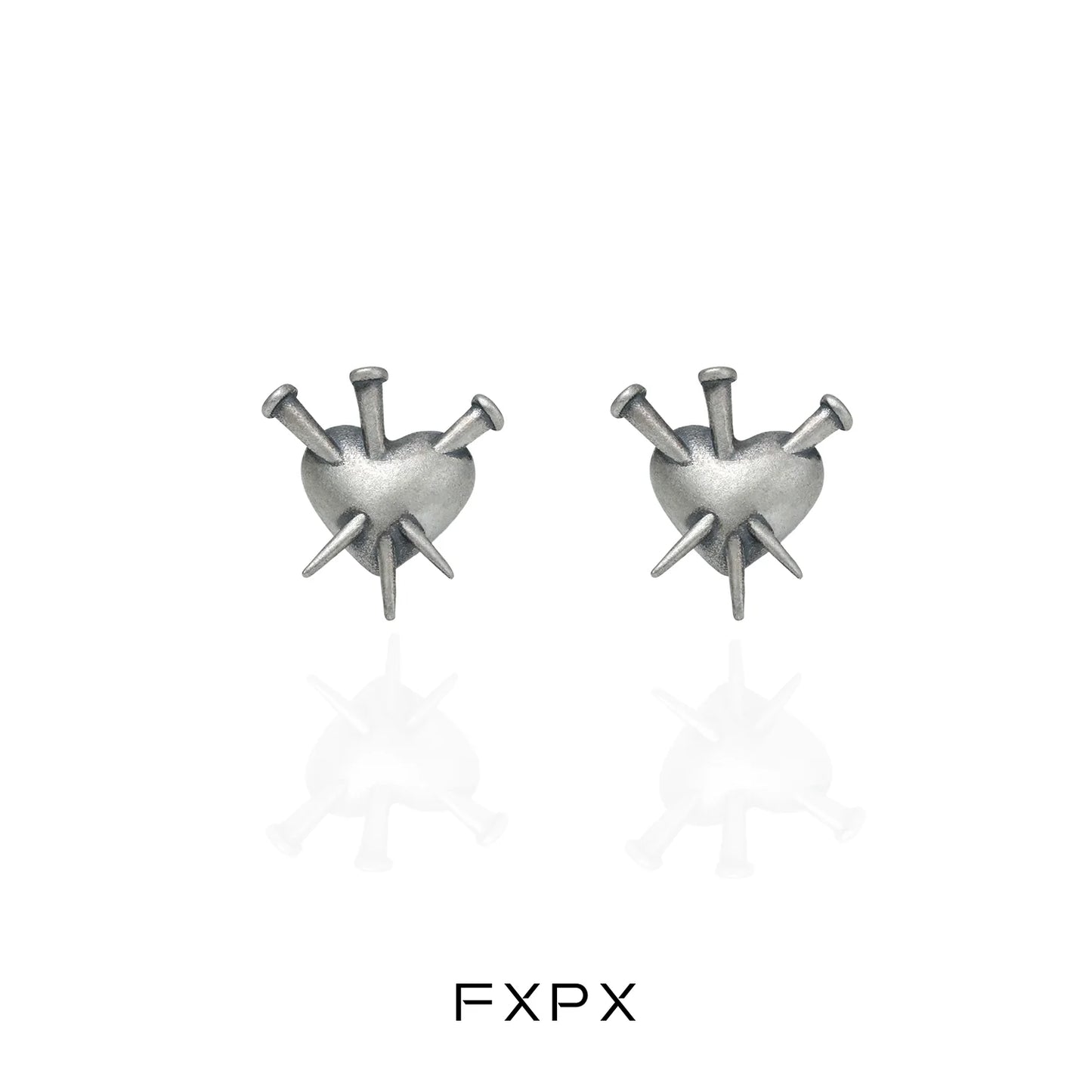 Vintage punk silver earrings featuring a heart design with spikes for a bold fashion statement