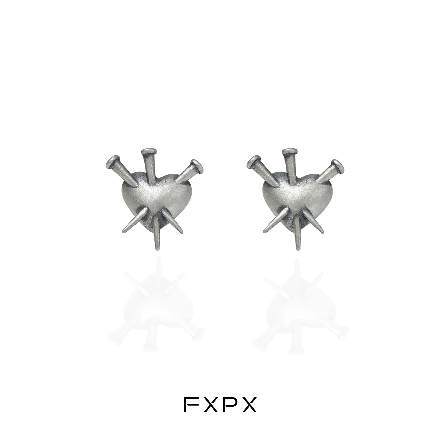 Vintage punk silver earrings featuring a heart design with spikes for a bold fashion statement