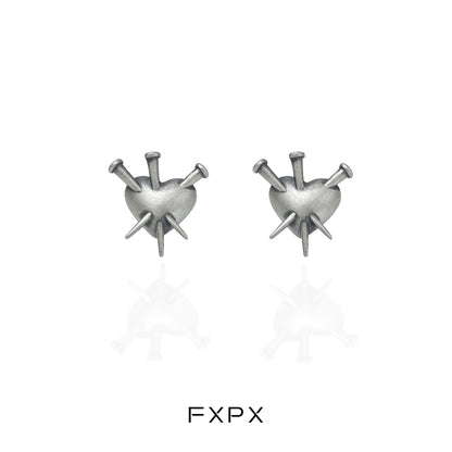 Vintage punk silver earrings featuring a heart design with spikes for a bold fashion statement