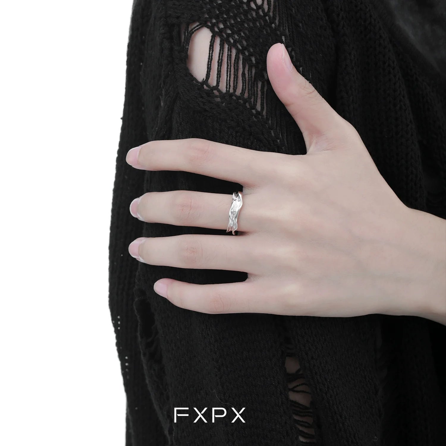 Stylish FXPX voyage texture ring showcased on a hand with a casual black sweater