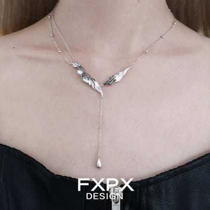 Y2K black feather necklace featuring a layered design with silver accents for a trendy look