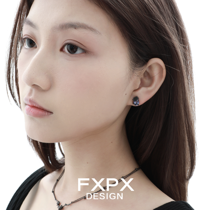 Model wearing Y2K blue rose earrings showcasing vintage-inspired floral design and elegant style