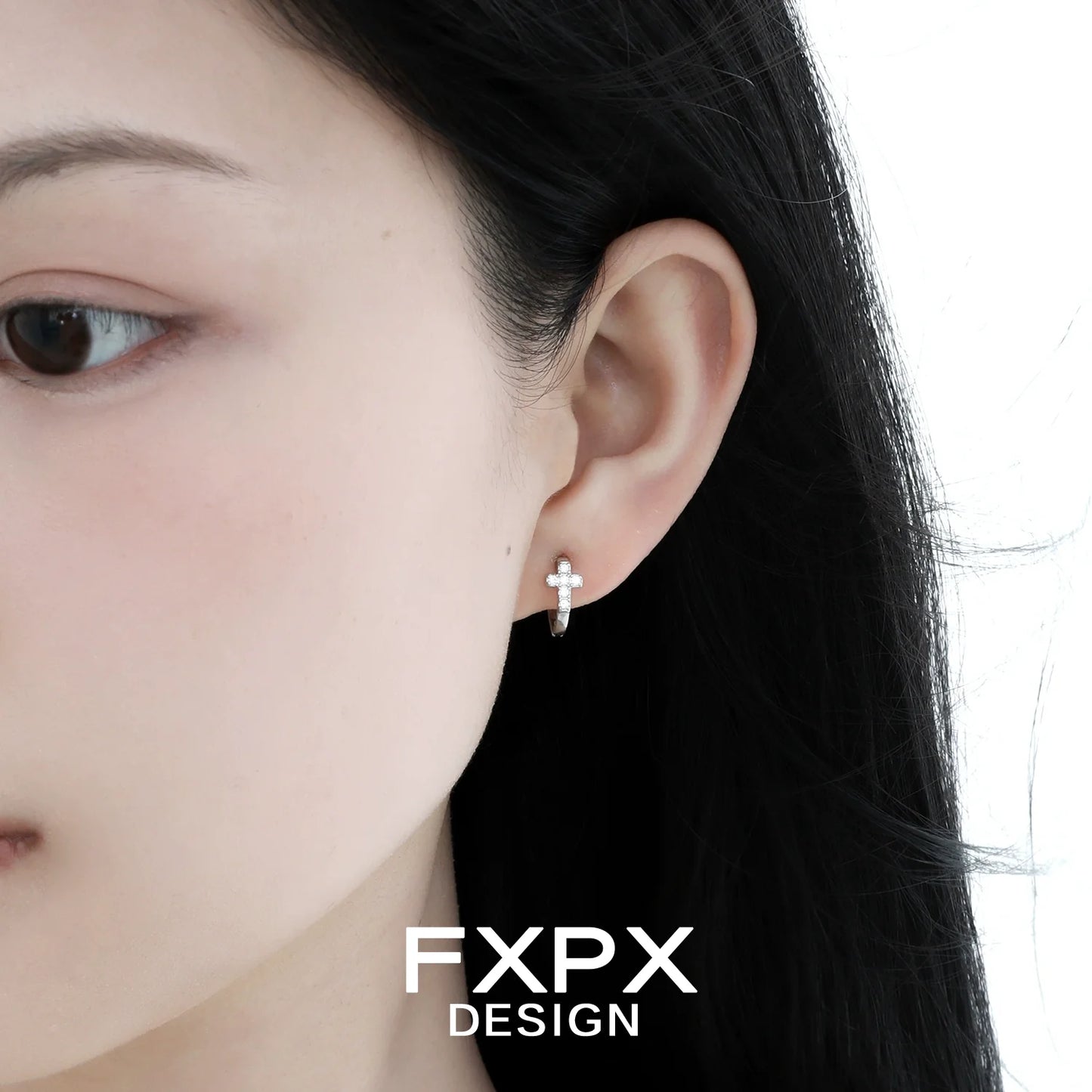 FXPX Y2K cross earrings displayed on a model's ear showcasing a stylish and trendy design