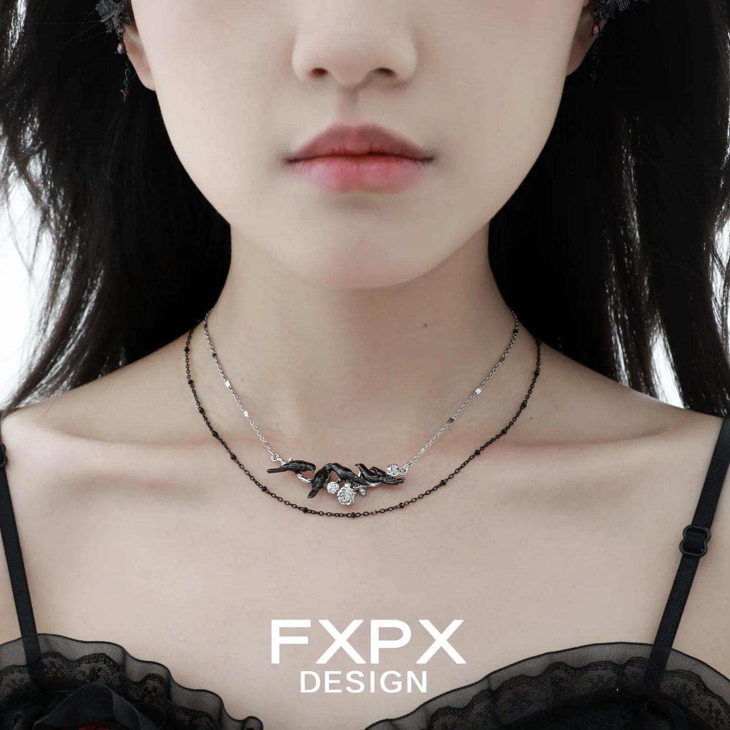 Y2K crow pendant necklace by FXPX showcased on a model with a chic outfit