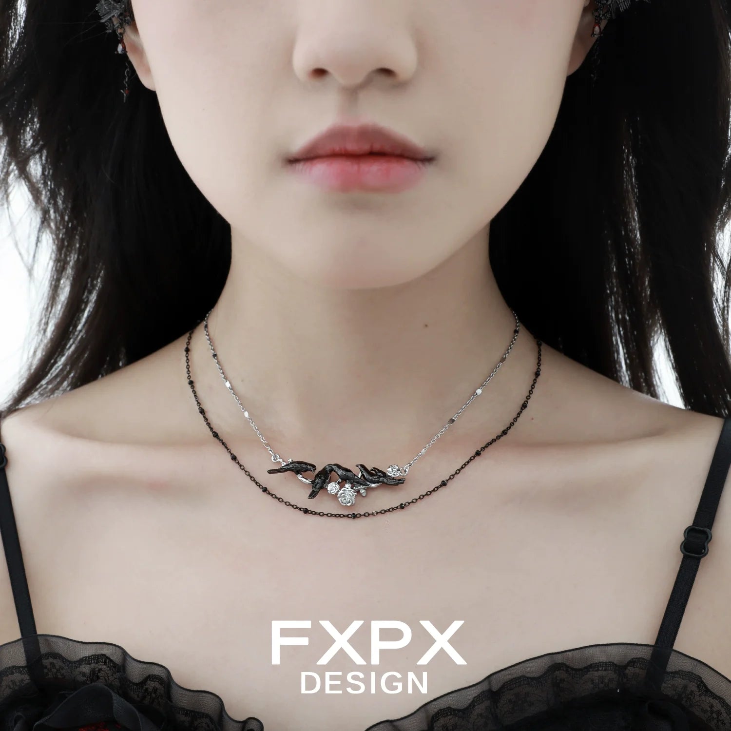 Y2K crow pendant necklace by FXPX showcased on a model with a chic outfit
