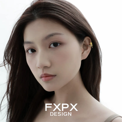 Y2K golden rose ear cuff worn by a model with long hair for a trendy look