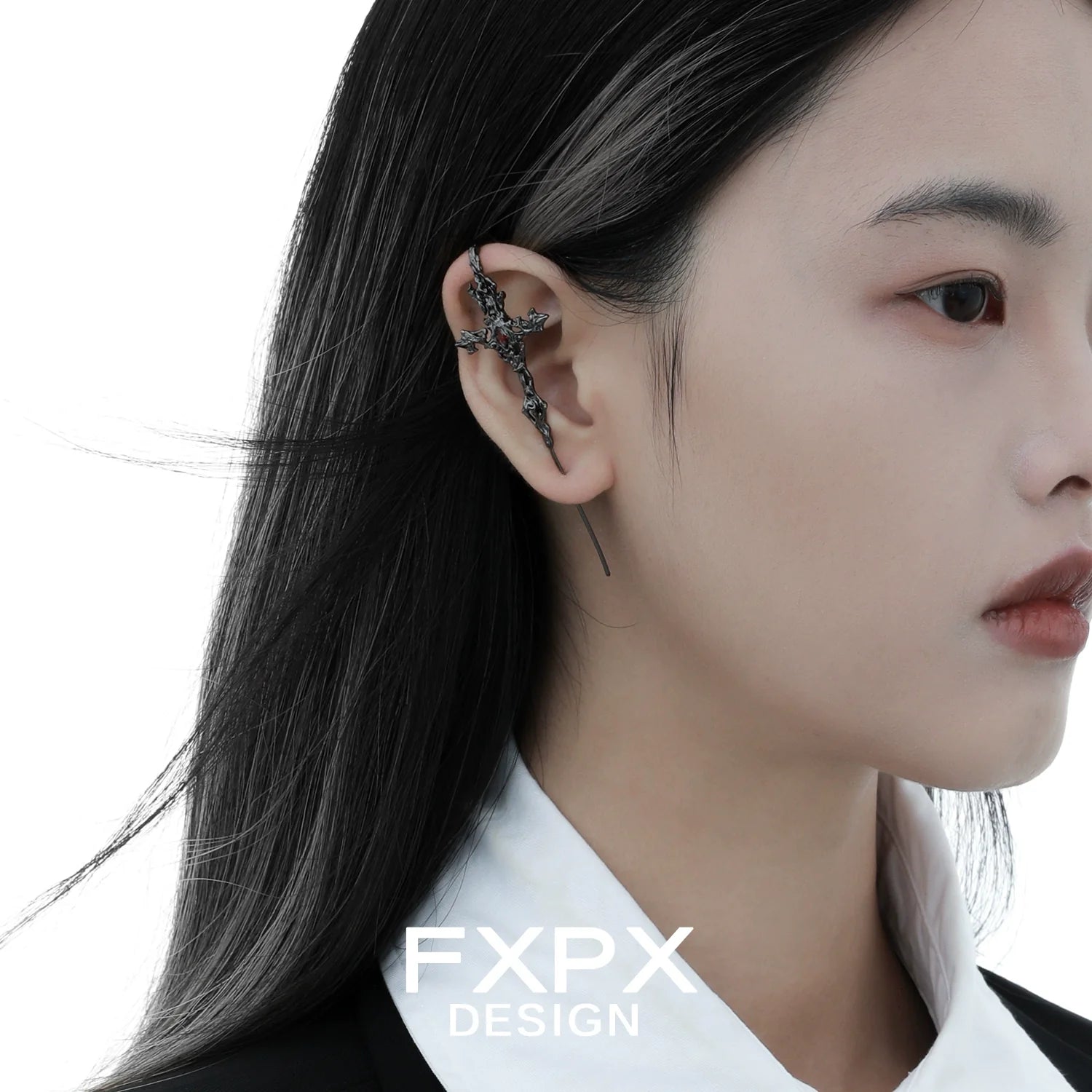 Y2K gothic cross earring designed by FXPX, showcasing a unique and stylish accessory on a model.
