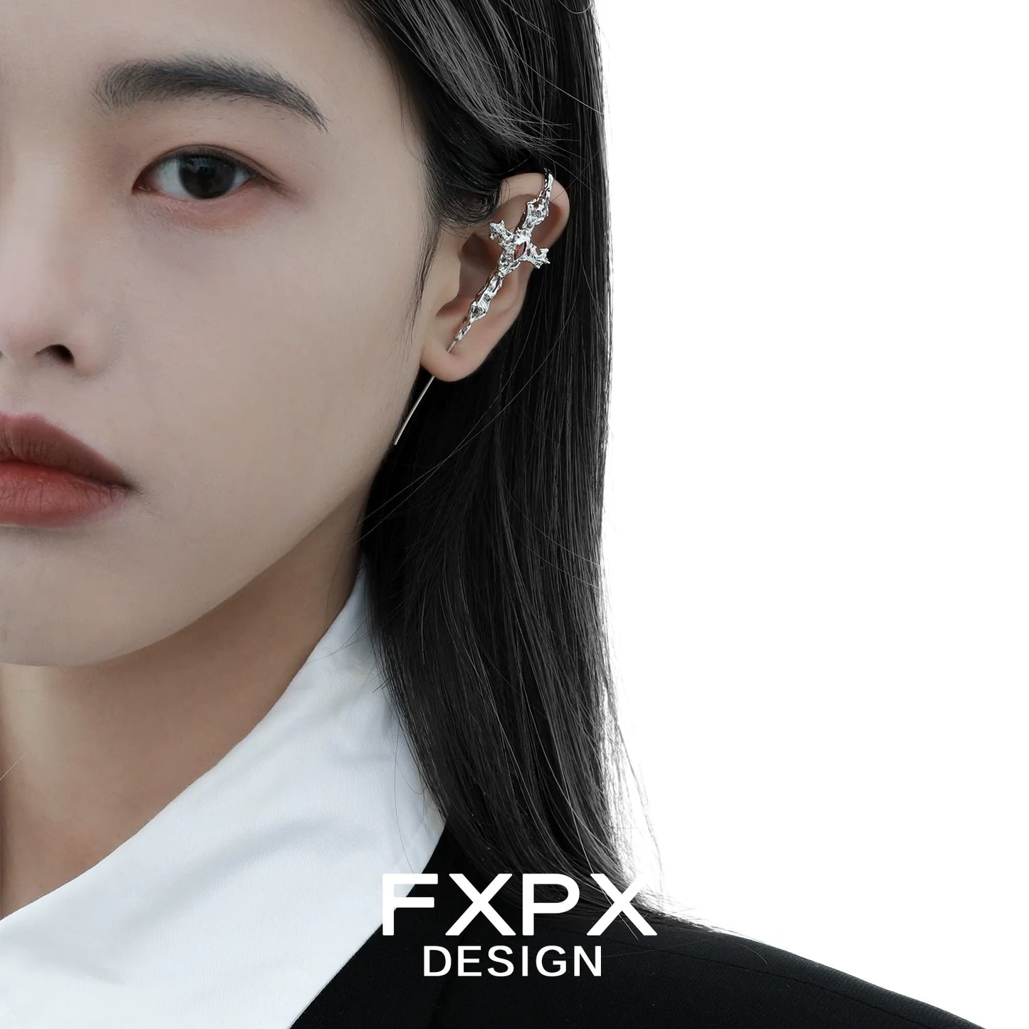 Trendy FXPX Y2K gothic cross earring displayed on a model with black hair and a stylish outfit