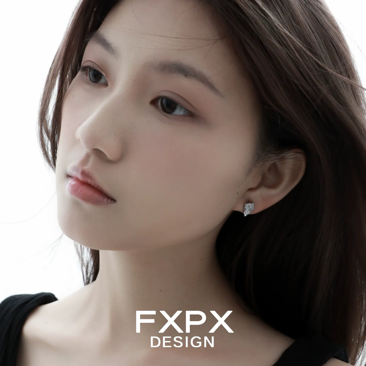 Model wearing FXPX Y2K meteor earrings, featuring a unique design and sparkling gemstones