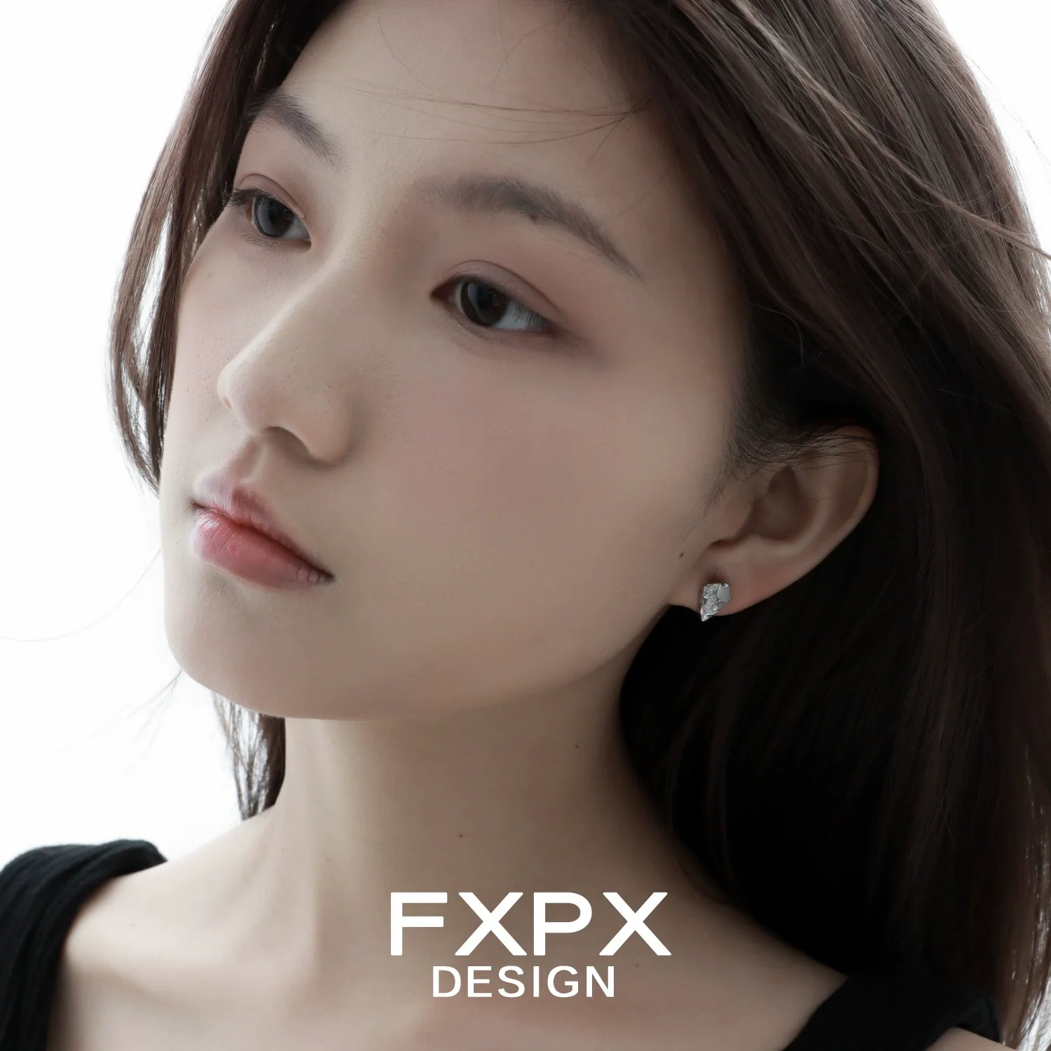 Model wearing FXPX Y2K meteor earrings, featuring a unique design and sparkling gemstones