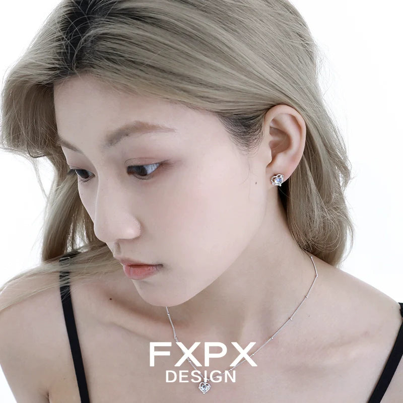 Stylish FXPX Y2K moonstone earrings worn by a model with short hair