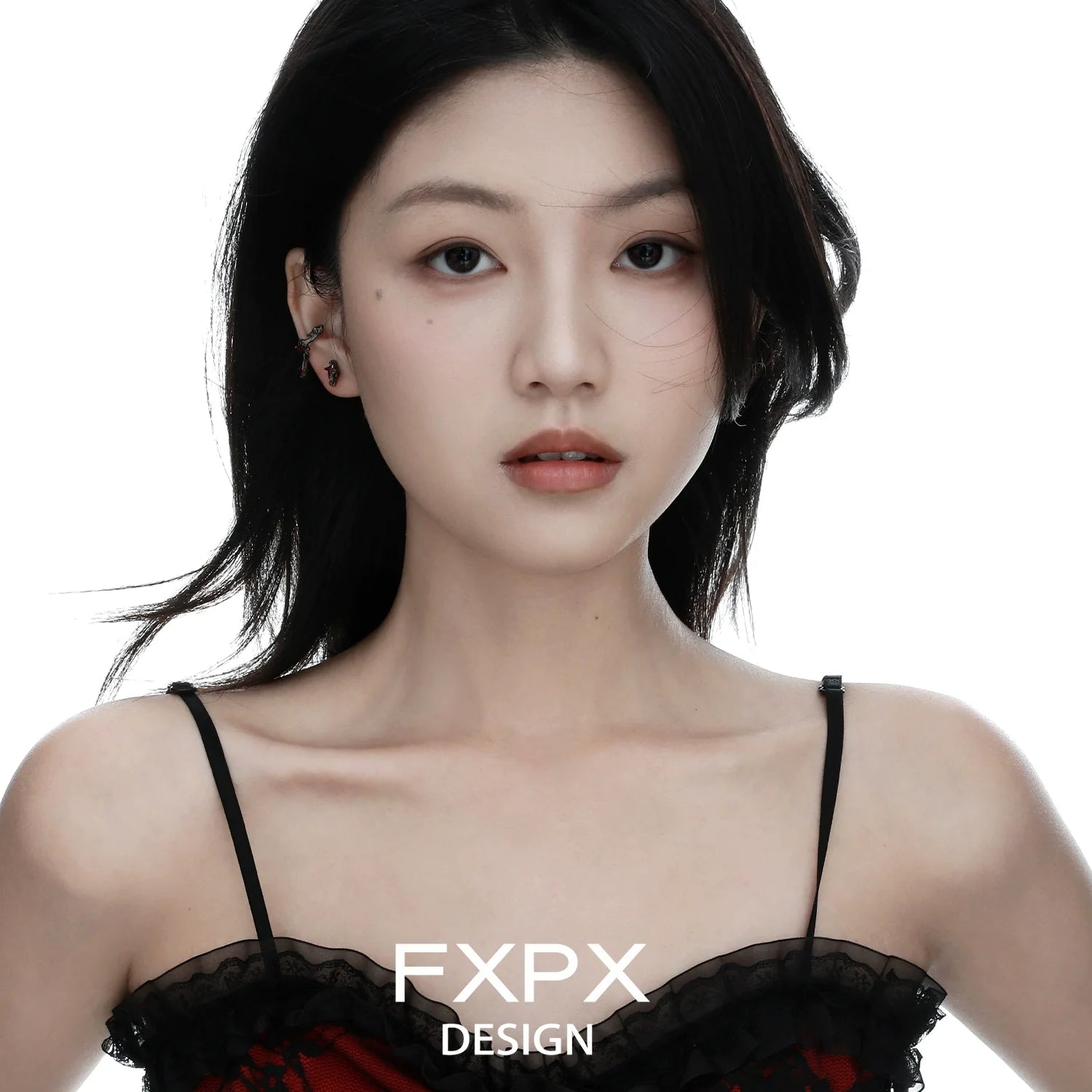 Y2K orange stud earrings showcased on a model with long dark hair in a stylish outfit