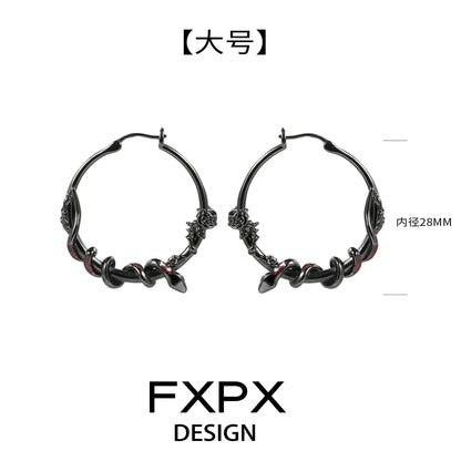FXPX Y2K ouroboros earrings in black with intricate twisted design and hoop style