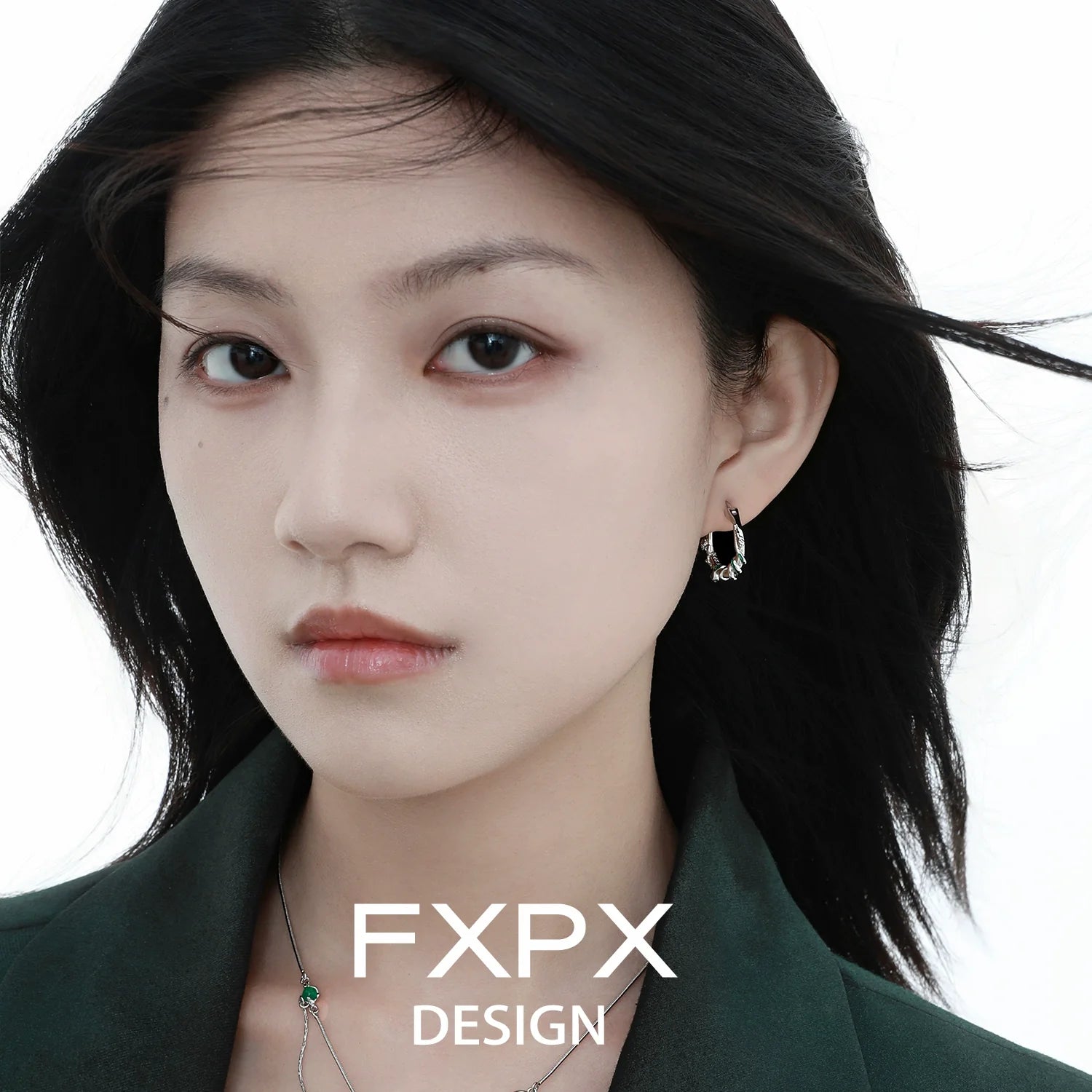 Model wearing Y2K ouroboros earrings showcasing a unique design and modern aesthetic