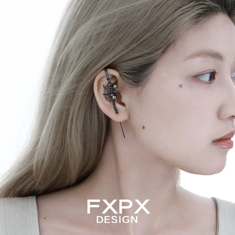 Y2K spider ear piercing jewelry with a unique design displayed on a model's ear