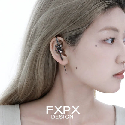 Y2K spider ear piercing jewelry with a unique design displayed on a model's ear