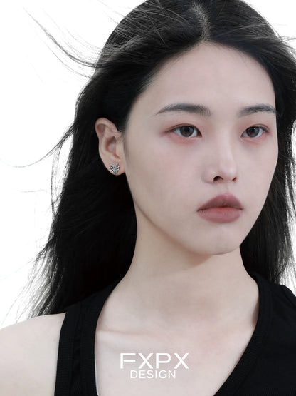 FXPX Y2K spider web earrings showcased on a model with flowing hair and a neutral expression