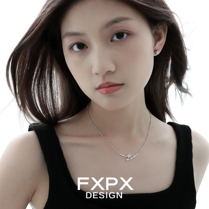 Stylish model wearing Y2K starfish earrings and a delicate necklace from FXPX