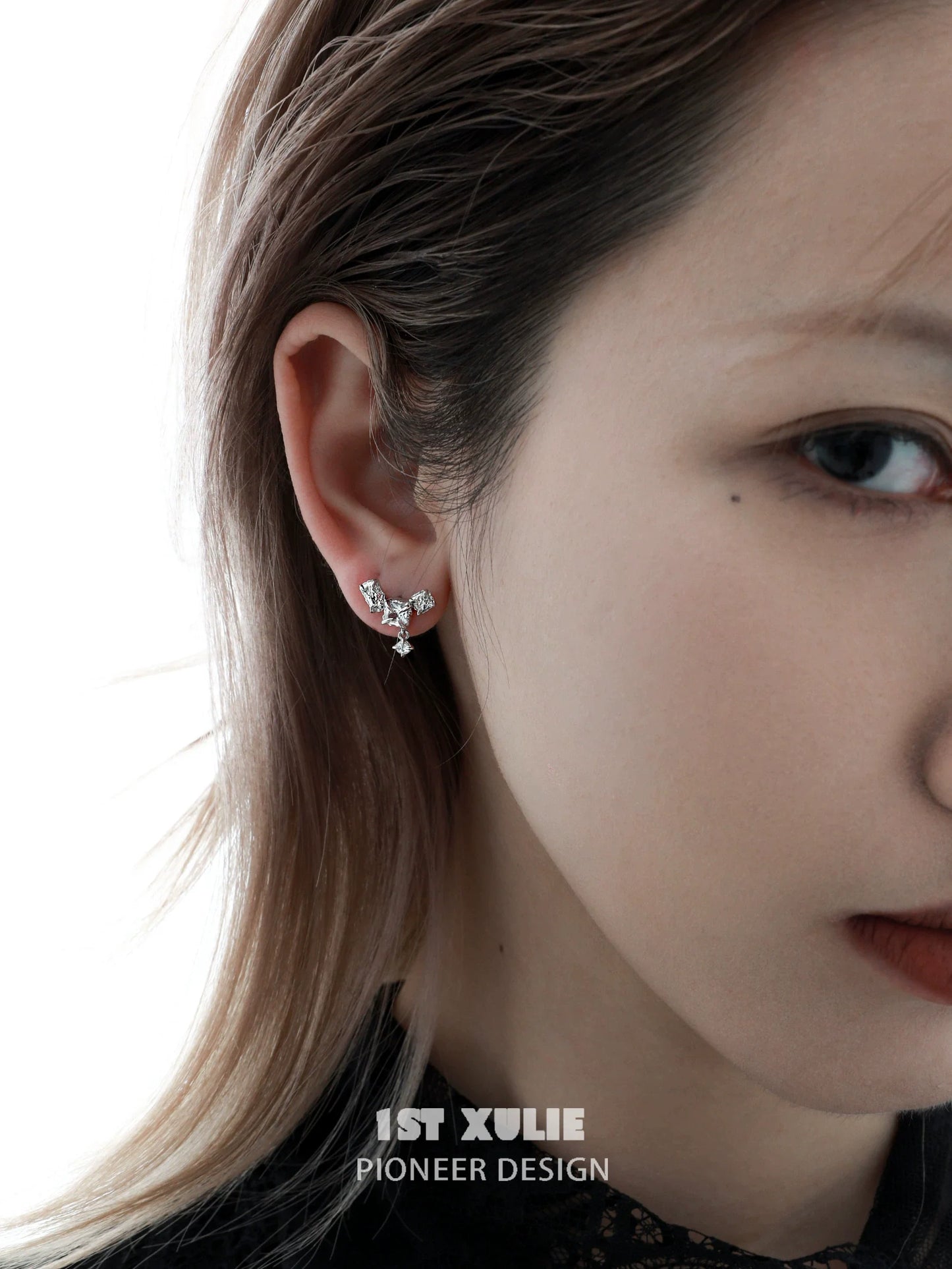 Elegant geometric silver earrings featuring a unique design perfect for contemporary fashion