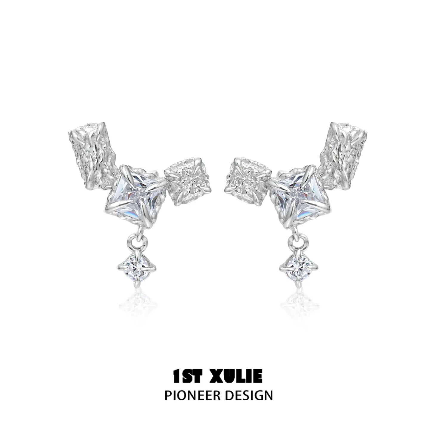 Geometric silver earrings featuring unique shapes and sparkling accents for a modern look