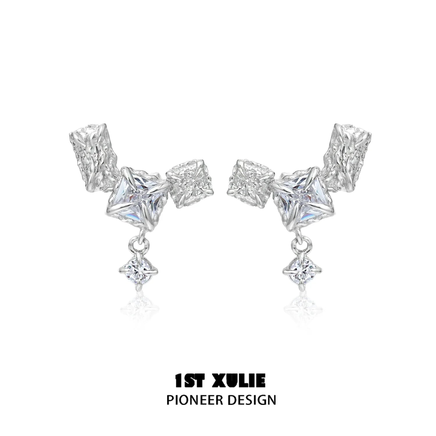 Geometric silver earrings featuring unique shapes and sparkling accents for a modern look