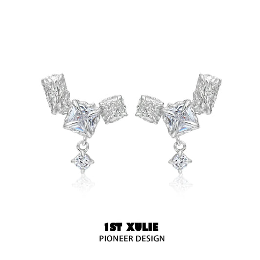 Geometric silver earrings featuring unique shapes and sparkling accents for a modern look