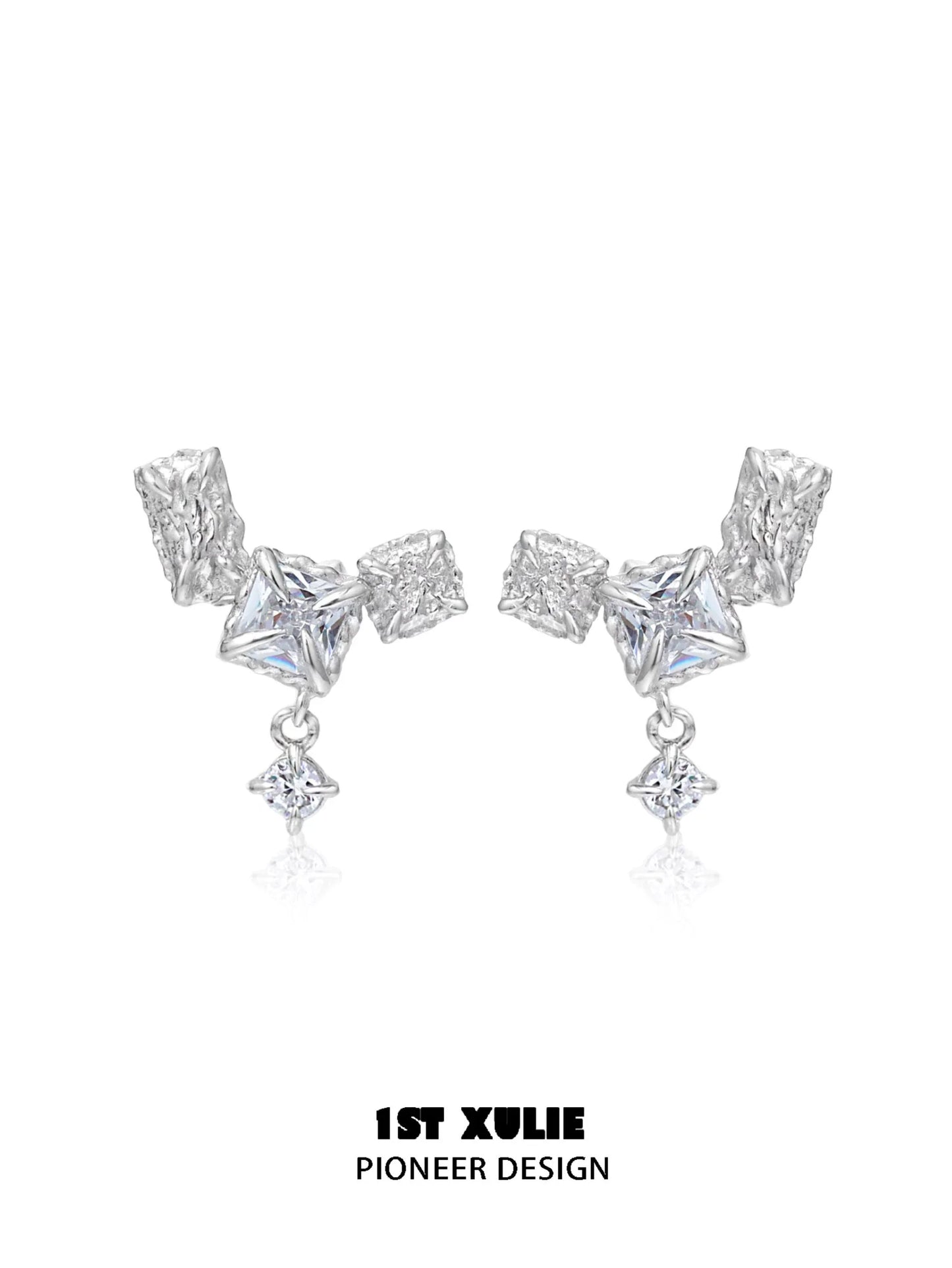 Geometric silver earrings with unique shapes and sparkling details for a modern look
