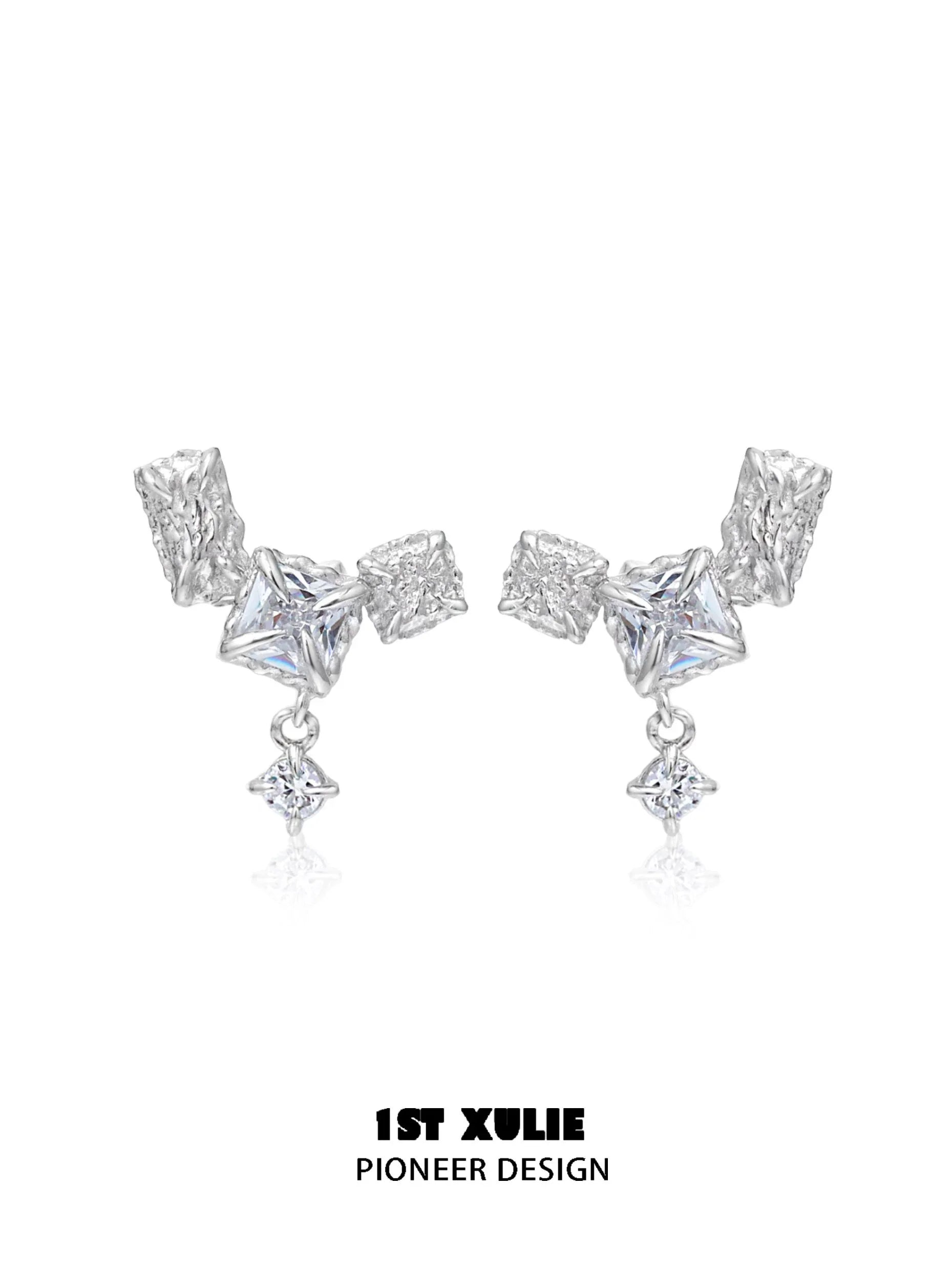 Geometric silver earrings with unique shapes and sparkling details for a modern look