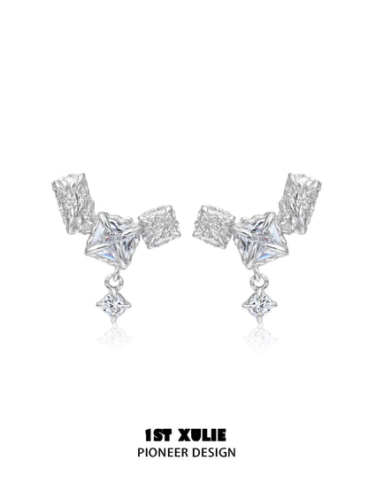 Geometric silver earrings with unique shapes and sparkling details for a modern look