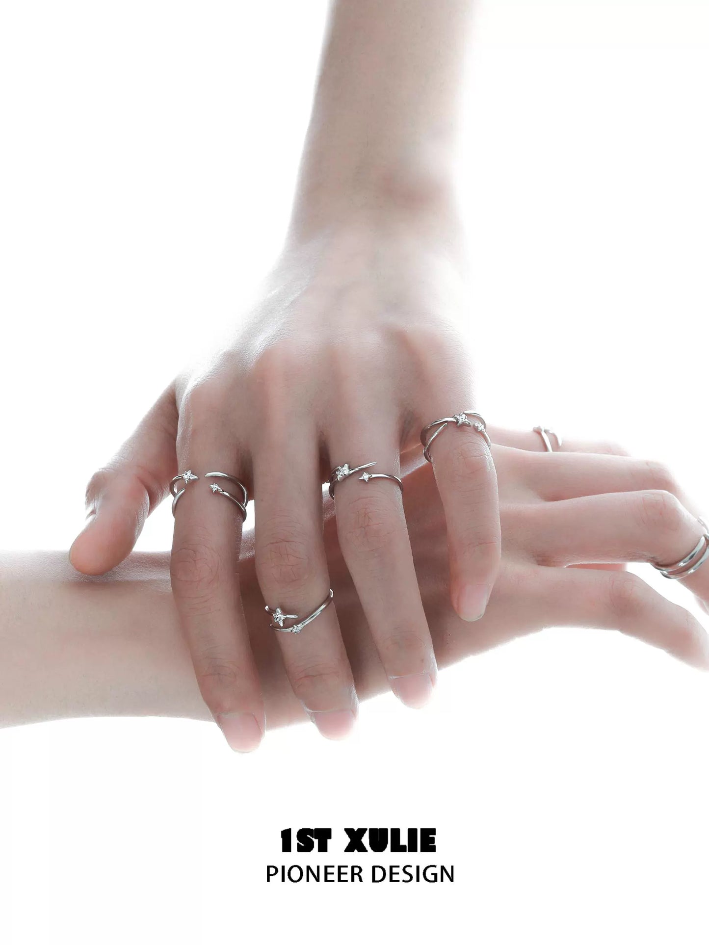 Stylish geometric silver ring worn on multiple fingers for modern fashion enthusiasts