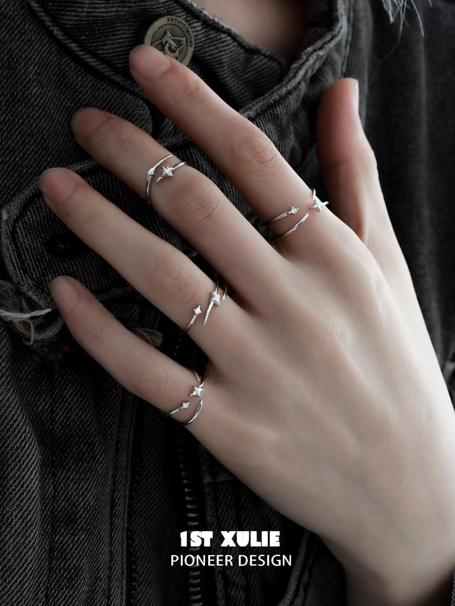 Stylish geometric silver ring set displayed on a hand with three minimalist designs for modern jewelry lovers