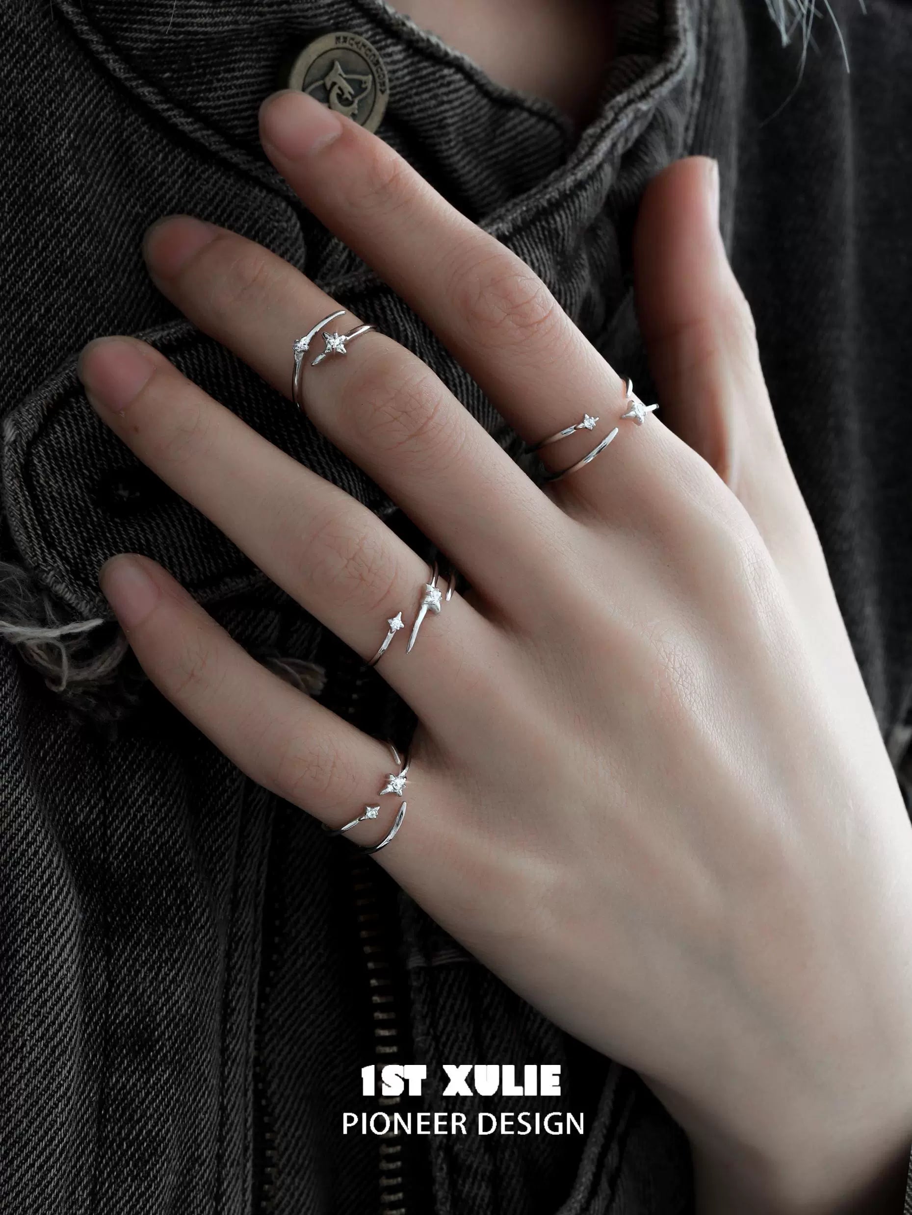 Stylish geometric silver ring set displayed on a hand with three minimalist designs for modern jewelry lovers