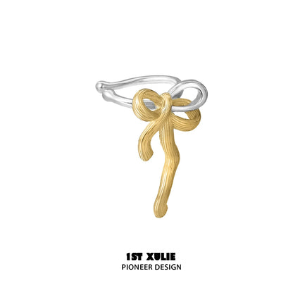 Gold bow ear cuff with intricate design for stylish jewelry lovers by 1STXULIE