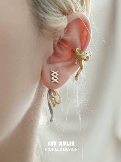 Stylish gold bow ear cuff by 1ST XULIE, elegantly designed for a trendy ear jewelry look