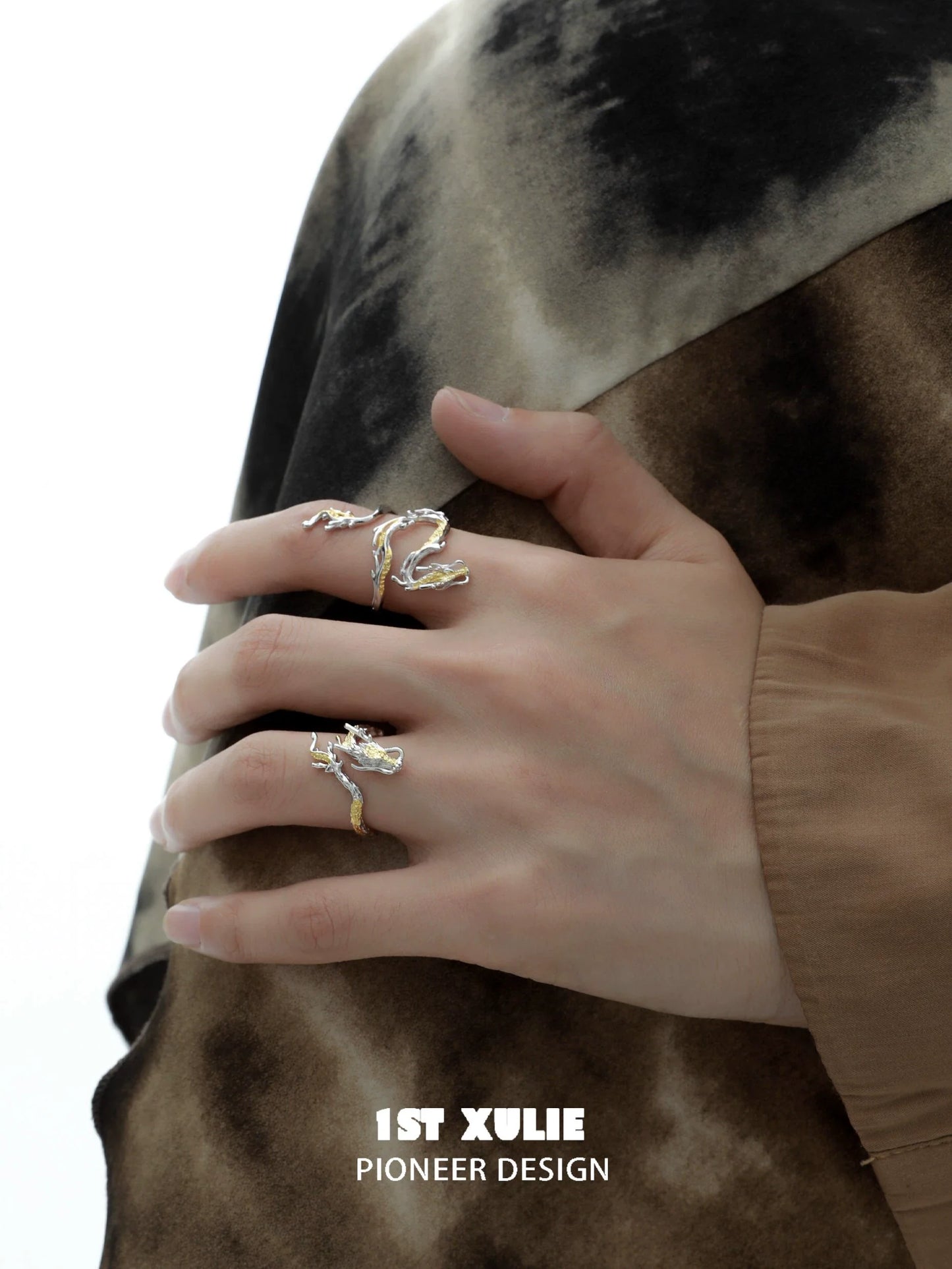 Stylish gold dragon wrap silver ring on model's hand, showcasing unique design and craftsmanship