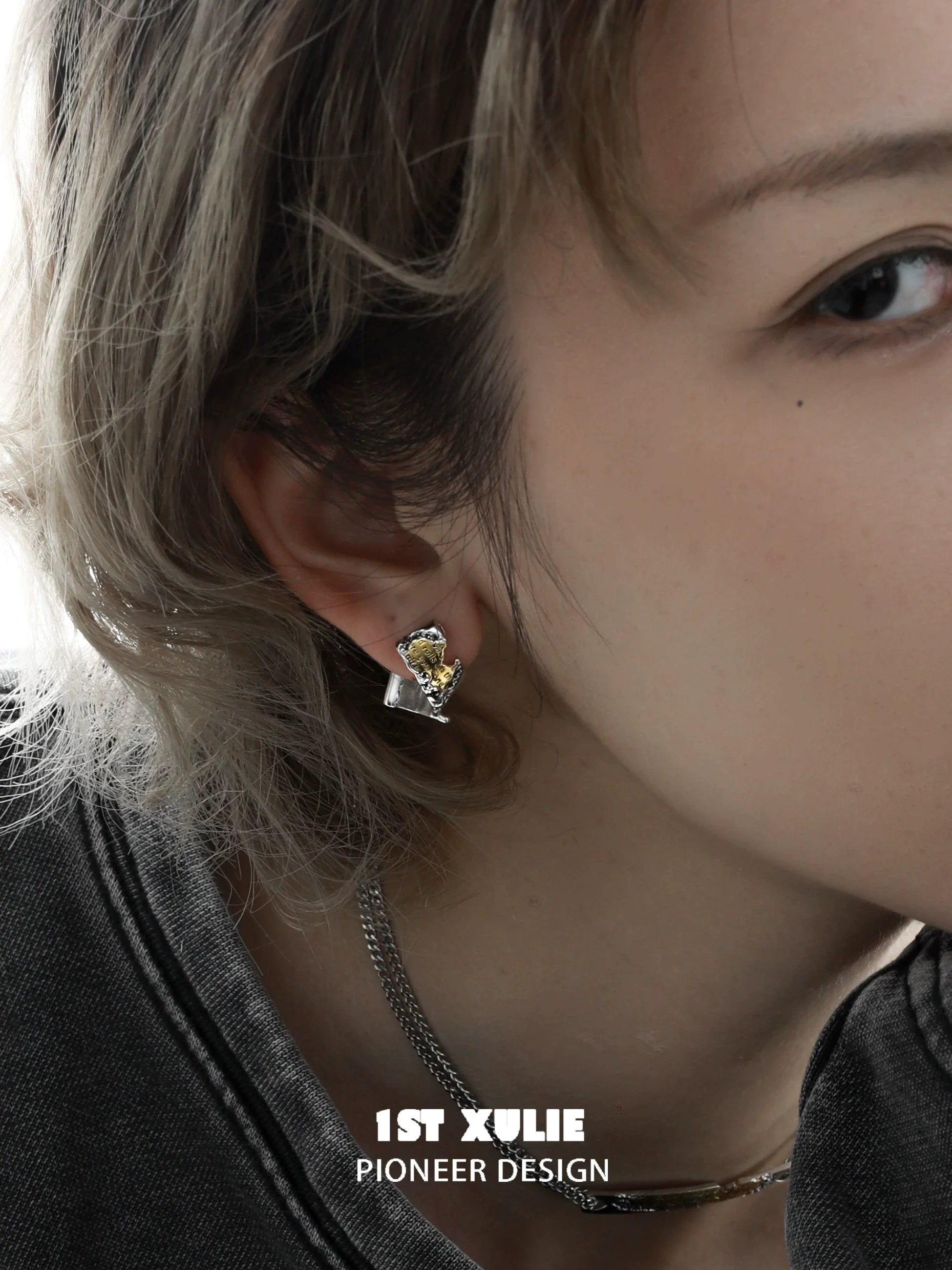 Elegant gold map earrings for women featuring a stylish design with a unique gemstone accent