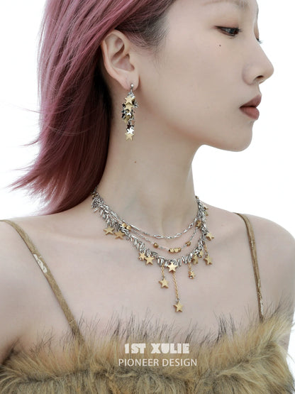 Gold star tassel necklace layered with silver accents, perfect for stylish accessorizing