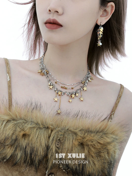Gold star tassel necklace layered with silver chains for a stylish, trendy look