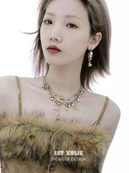 Gold star tassel necklace layered with delicate chains for a stylish and elegant accessory