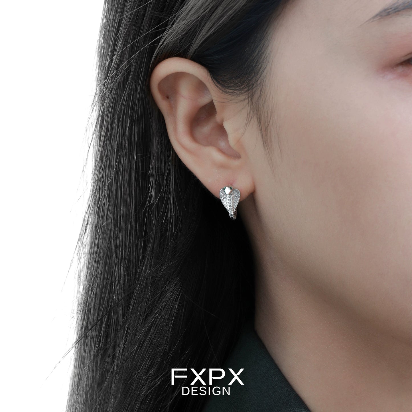 FXPX unique serpent earrings for women from Gothhalo Jewelry displayed on a model's ear