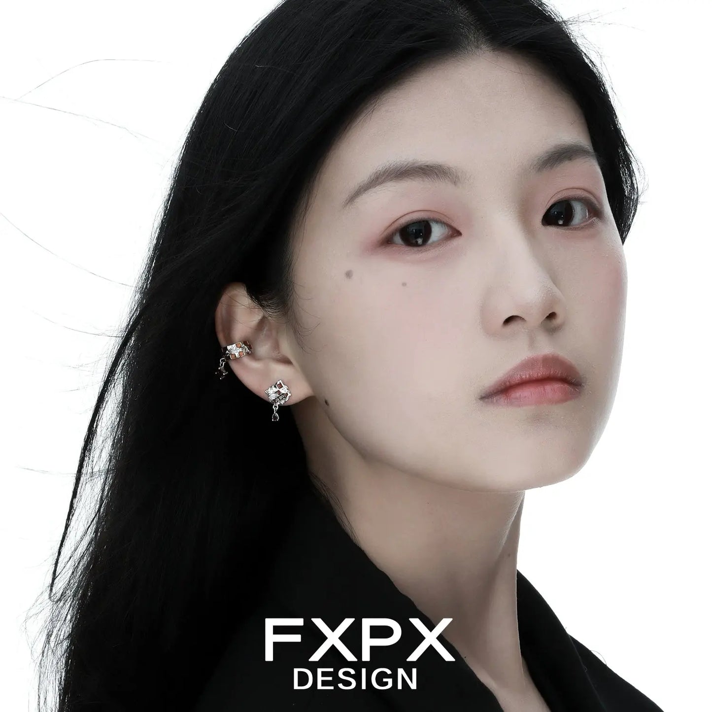 Woman wearing Gothhalo jewelry gothic checkerboard earrings with silver and black design