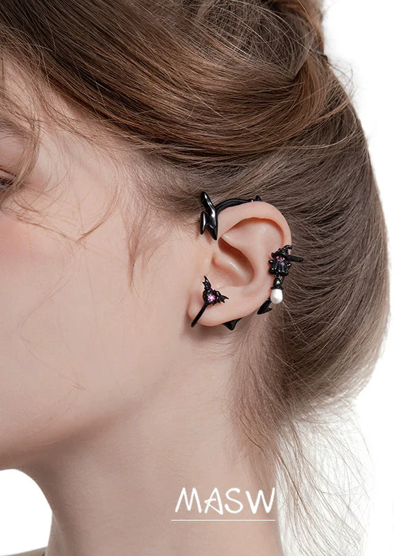 MASW jewelry gothic ghost dangle earrings from Gothhalo Jewelry worn by a model showcasing their unique design