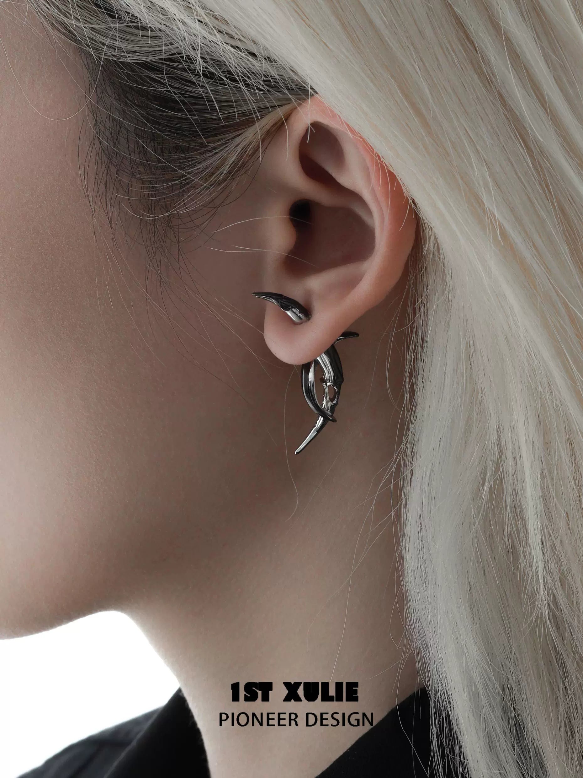 Stylish Y2K moon earrings in silver worn on ear for a trendy look