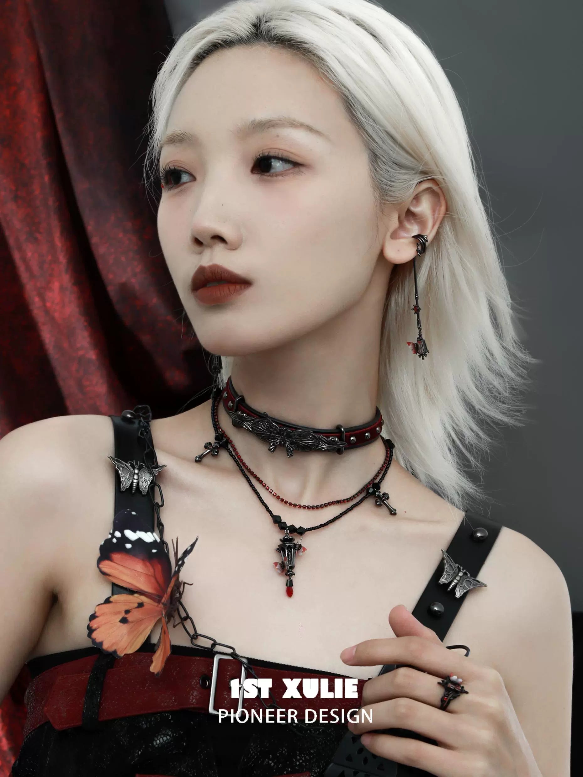 Gothic butterfly earrings paired with a matching choker for a stylish dark fashion statement
