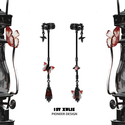 Gothic butterfly earrings with red and black design, featuring intricate detailing and a unique silhouette