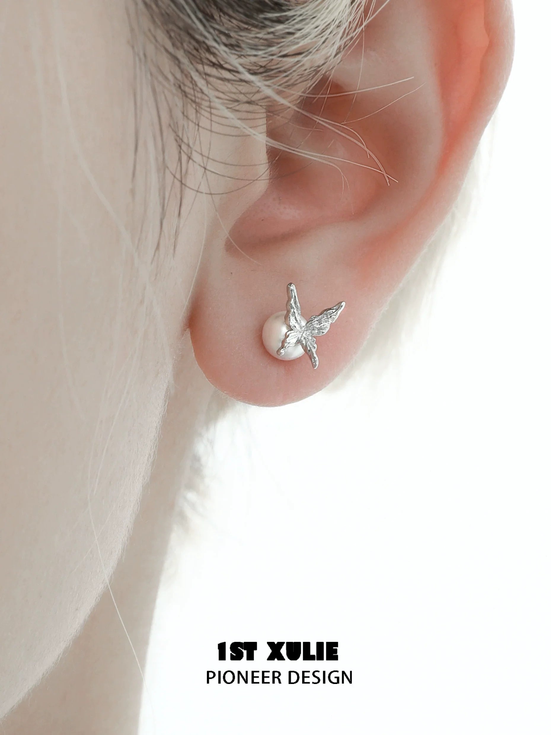 Gothic butterfly earrings featuring a silver butterfly design and a pearl detail for unique style