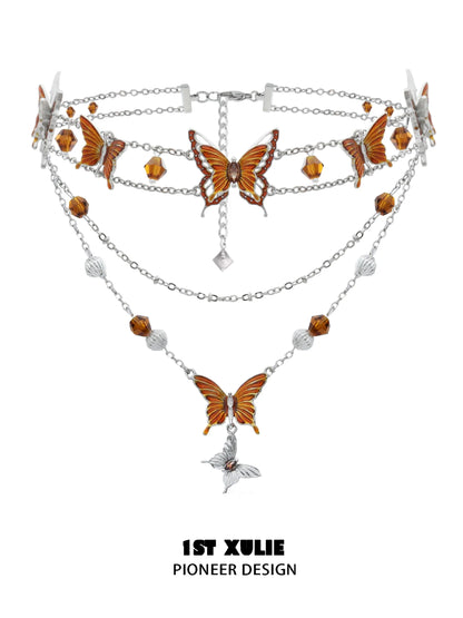 Gothic butterfly necklace with intricate orange butterfly charms and silver chains for a unique look