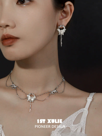 Elegant gothic butterfly necklace with star accents, perfect for unique fashion statements