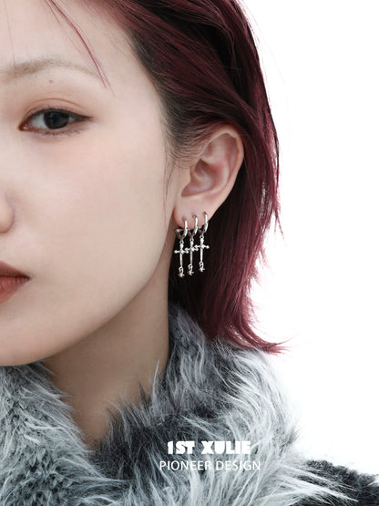 Stylish gothic cross earrings featuring multiple hanging crosses for a trendy look