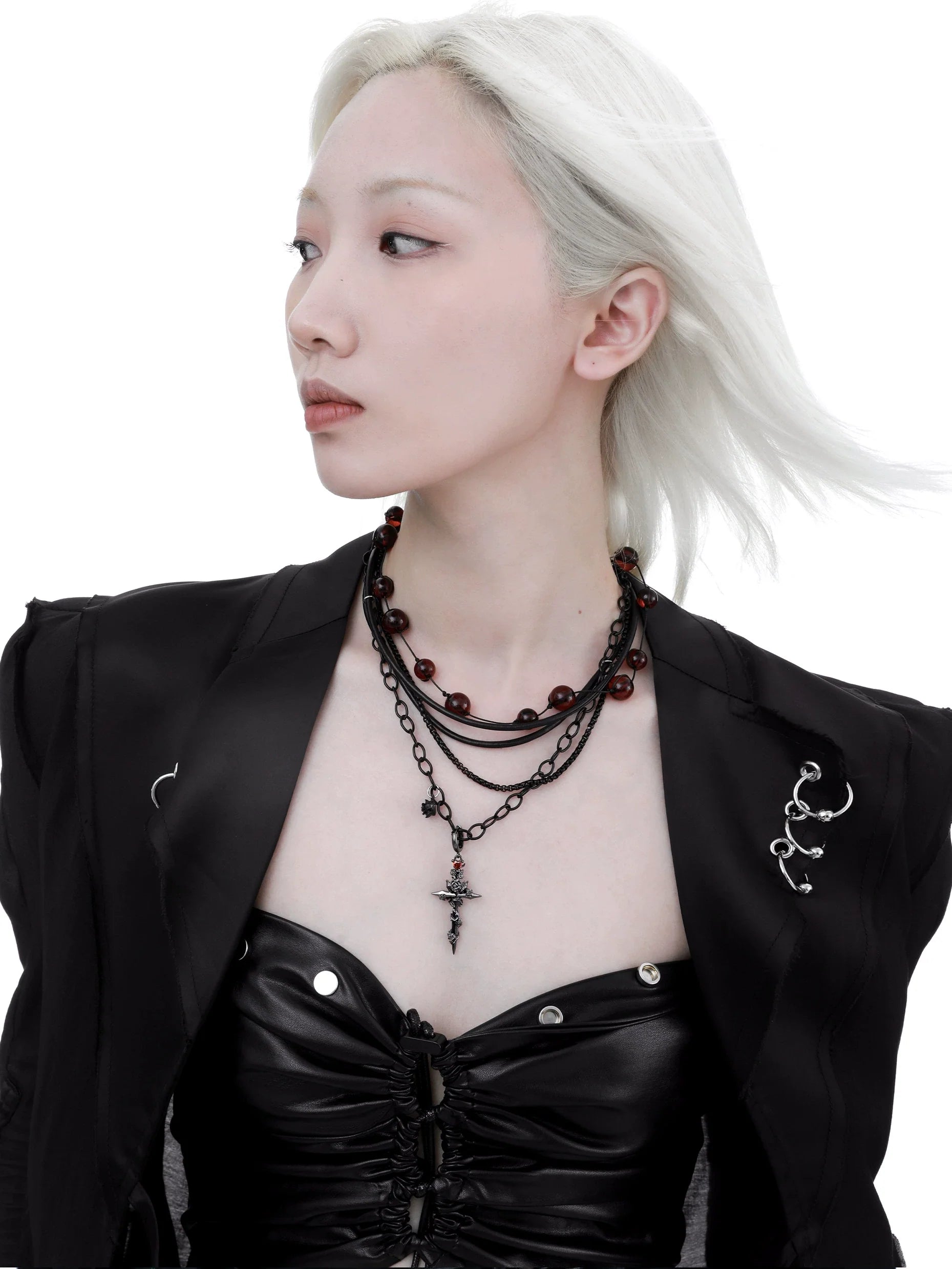 Elegant gothic cross necklace featuring layered chains and a striking cross pendant